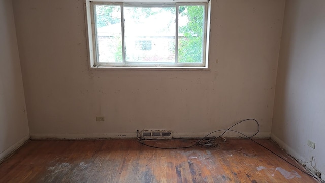 9426 S Peoria St, Chicago, IL 60620 - empty room featuring plenty of natural light and wood finished floors