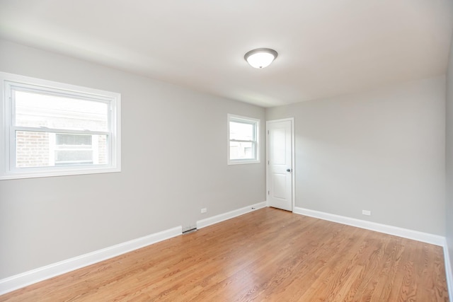 2101 W 82nd Pl, Chicago, IL 60620 - unfurnished room with baseboards and light wood finished floors