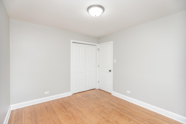 2101 W 82nd Pl, Chicago, IL 60620 - unfurnished bedroom featuring light wood-style flooring and a closet
