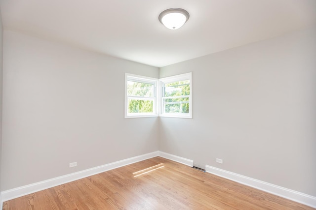 2101 W 82nd Pl, Chicago, IL 60620 - empty room featuring baseboards and light wood-style flooring