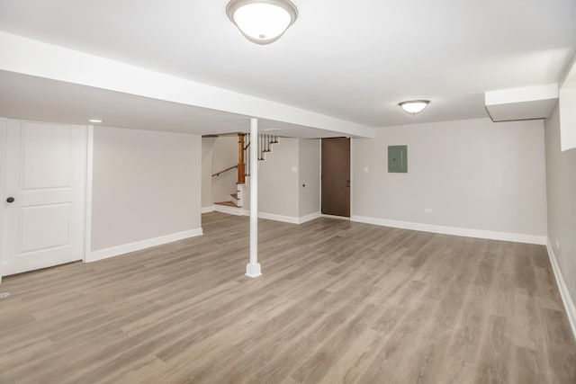 2101 W 82nd Pl, Chicago, IL 60620 - finished below grade area with electric panel, stairs, and light wood-style floors