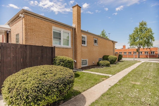 2101 W 82nd Pl, Chicago, IL 60620 - view of side of home featuring a chimney and brick siding