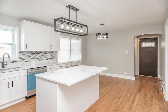 2101 W 82nd Pl, Chicago, IL 60620 - kitchen with stainless steel dishwasher, backsplash, pendant lighting, and white cabinetry