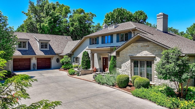 524 E Van Buren St, Ottawa, IL 61350 - view of front of property with a chimney, stone siding, and concrete driveway