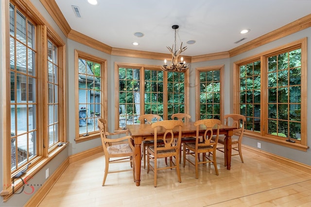 524 E Van Buren St, Ottawa, IL 61350 - dining space featuring ornamental molding, healthy amount of natural light, a chandelier, light wood finished floors, and recessed lighting