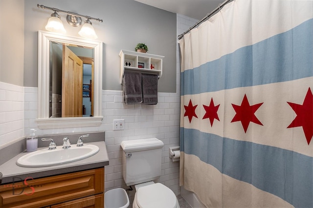 524 E Van Buren St, Ottawa, IL 61350 - bathroom featuring tile walls, vanity, wainscoting, and curtained shower