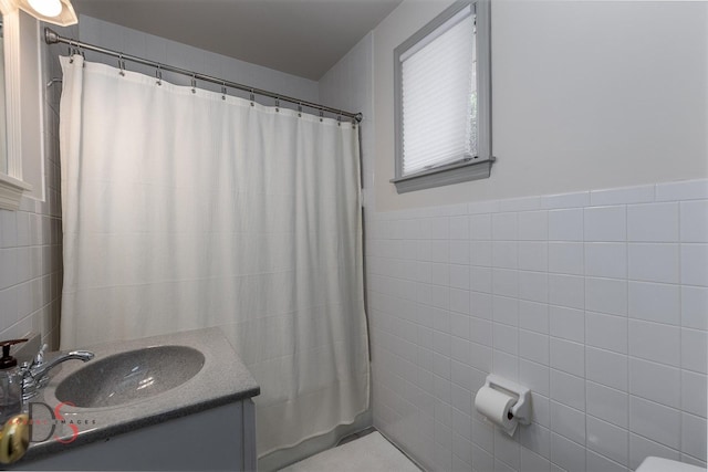524 E Van Buren St, Ottawa, IL 61350 - bathroom with tile walls, vanity, and a shower with curtain