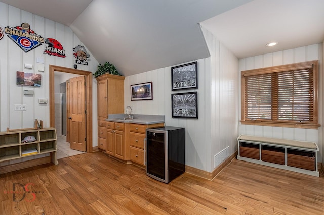 524 E Van Buren St, Ottawa, IL 61350 - bar featuring light wood-type flooring, beverage cooler, and vaulted ceiling