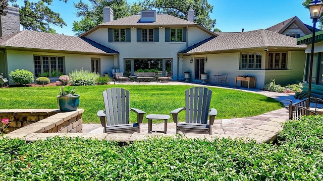 524 E Van Buren St, Ottawa, IL 61350 - back of property featuring a chimney, brick siding, a patio, and a yard