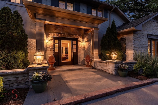 524 E Van Buren St, Ottawa, IL 61350 - view of exterior entry featuring covered porch and stone siding