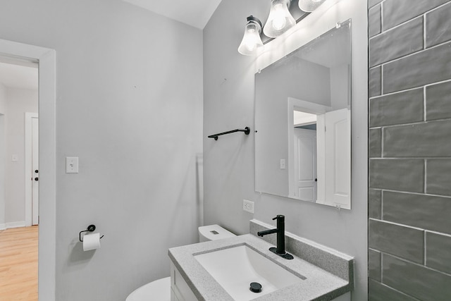 918 W Sunnyside Ave Unit 1B, Chicago, IL 60640 - bathroom featuring vanity and wood finished floors