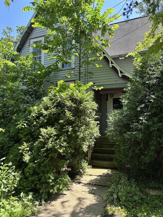114 E Brown St, West Chicago, IL 60185 - view of side of property with a shingled roof