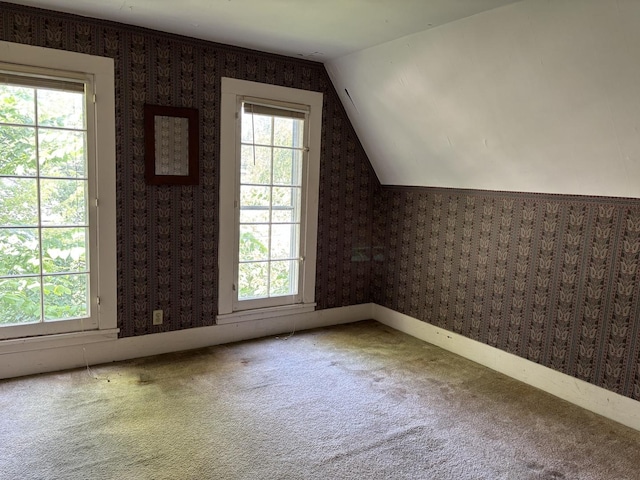 114 E Brown St, West Chicago, IL 60185 - additional living space with carpet flooring, wallpapered walls, and vaulted ceiling