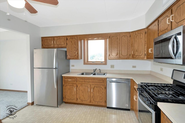 8838 W 140th St Unit 2D, Orland Park, IL 60462 - kitchen featuring stainless steel appliances, a ceiling fan, light countertops, and brown cabinetry