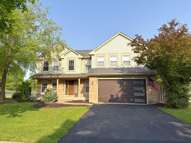 1860 Dorchester Ave, Algonquin, IL 60102 - view of front of home with a garage, asphalt driveway, a front yard, and brick siding