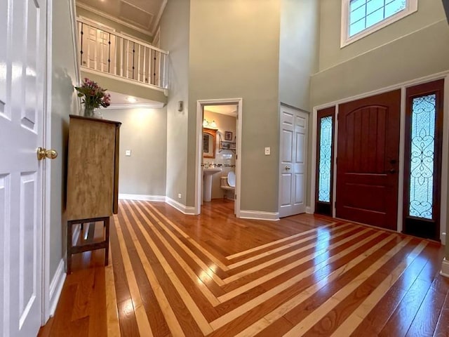 1860 Dorchester Ave, Algonquin, IL 60102 - foyer entrance featuring hardwood / wood-style flooring, a towering ceiling, and ornamental molding