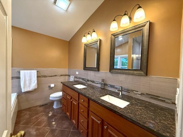 1860 Dorchester Ave, Algonquin, IL 60102 - full bathroom with tile patterned floors, double vanity, tile walls, lofted ceiling, and a wainscoted wall