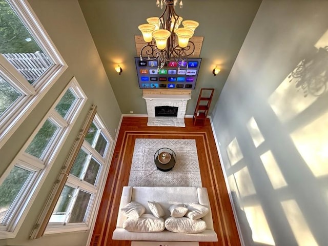 1860 Dorchester Ave, Algonquin, IL 60102 - living area with a towering ceiling, a chandelier, and a fireplace