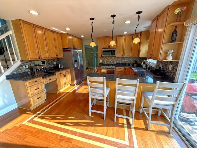 1860 Dorchester Ave, Algonquin, IL 60102 - kitchen featuring stainless steel appliances, tasteful backsplash, brown cabinets, light wood finished floors, and recessed lighting