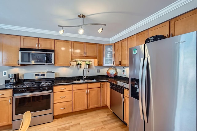 8712 W Berwyn Ave Unit 3W, Chicago, IL 60656 - kitchen with stainless steel appliances, crown molding, dark stone countertops, light wood-style floors, and glass insert cabinets