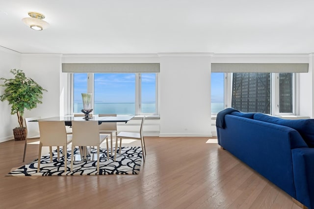 132 E Delaware Pl Unit 5504, Chicago, IL 60611 - dining space featuring wood finished floors and crown molding