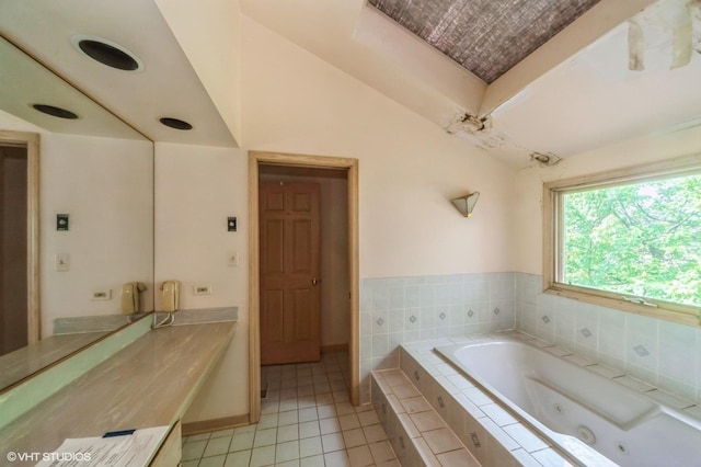 1940 Cypress Ln, Northbrook, IL 60062 - full bath with vaulted ceiling, a jetted tub, tile patterned floors, and vanity