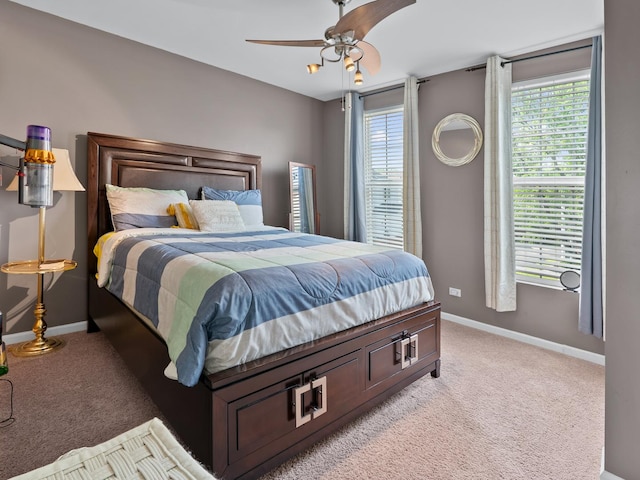 1597 Plum Tree Ln, Aurora, IL 60504 - bedroom featuring light carpet, multiple windows, and ceiling fan