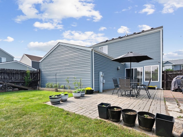 1597 Plum Tree Ln, Aurora, IL 60504 - rear view of property with a patio area