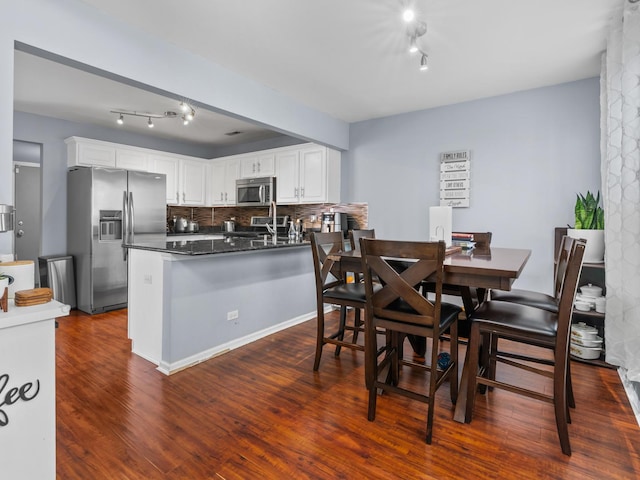 1597 Plum Tree Ln, Aurora, IL 60504 - dining space with dark wood-type flooring and track lighting