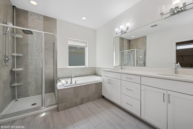 1434 Somerset Pl, Barrington, IL 60010 - bathroom featuring double vanity, a shower stall, a garden tub, and recessed lighting