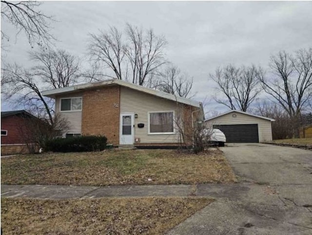 75 Water St, Park Forest, IL 60466 - view of front of house featuring a garage and an outbuilding