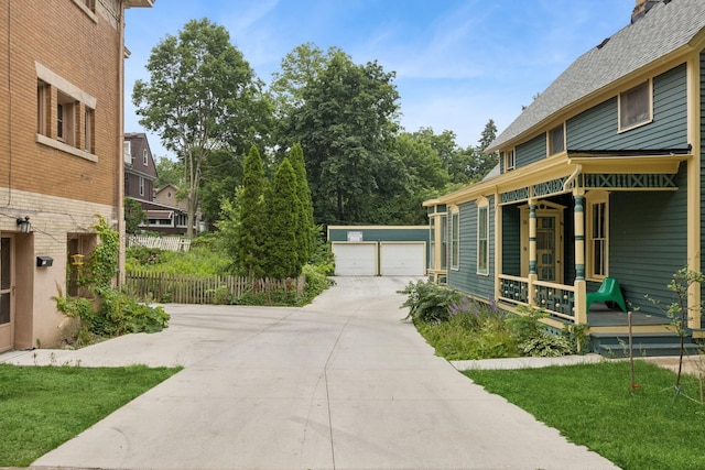 16 N Gifford St, Elgin, IL 60120 - view of yard featuring covered porch, an outdoor structure, and a detached garage