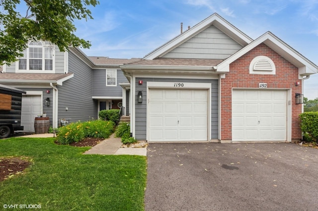 1190 Harbor Ct Unit 1190, Glendale Heights, IL 60139 - view of front of property featuring driveway, a garage, a front yard, roof with shingles, and brick siding
