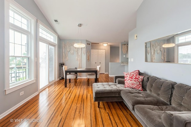 1190 Harbor Ct Unit 1190, Glendale Heights, IL 60139 - living room with lofted ceiling and light wood-style flooring