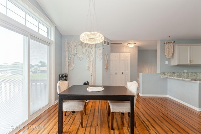 1190 Harbor Ct Unit 1190, Glendale Heights, IL 60139 - dining room featuring wood finished floors and a chandelier