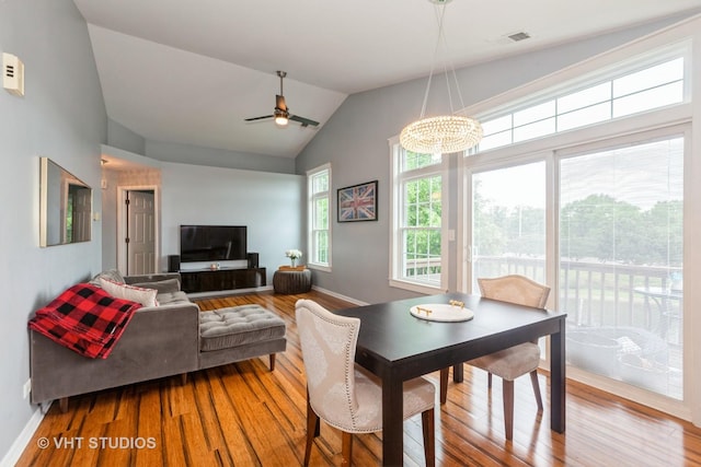 1190 Harbor Ct Unit 1190, Glendale Heights, IL 60139 - dining room with wood finished floors, vaulted ceiling, a chandelier, and a ceiling fan