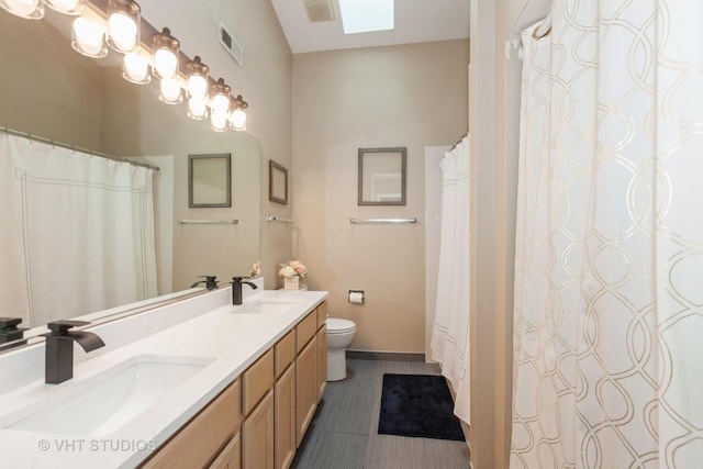 1190 Harbor Ct Unit 1190, Glendale Heights, IL 60139 - full bathroom with double vanity, a skylight, tile patterned floors, and a shower with shower curtain