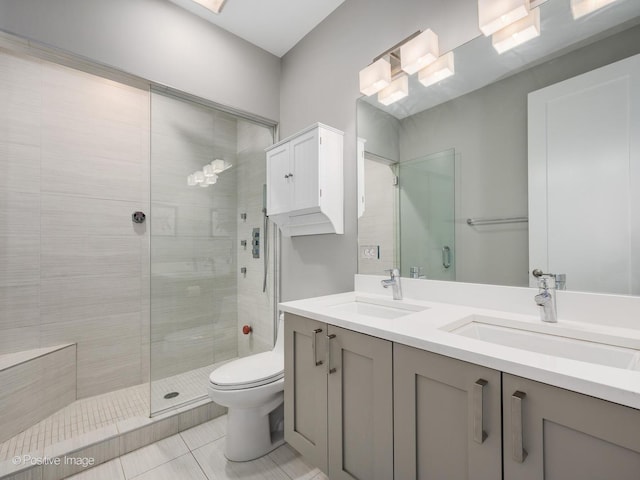 1310 N Western Ave Unit 2N, Chicago, IL 60622 - bathroom featuring double vanity, a tile shower, and tile patterned floors