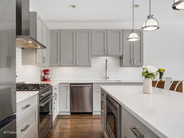 1310 N Western Ave Unit 2N, Chicago, IL 60622 - kitchen featuring stainless steel appliances, wall chimney exhaust hood, gray cabinetry, and recessed lighting