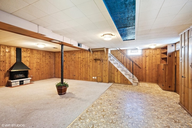 1609 Boeger Ave, Westchester, IL 60154 - basement with a wood stove, stairway, wood walls, and carpet flooring