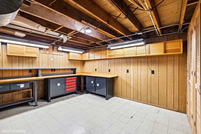 1609 Boeger Ave, Westchester, IL 60154 - below grade area with tile patterned floors, wood walls, and a workshop area