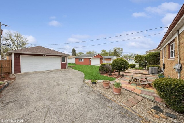 1609 Boeger Ave, Westchester, IL 60154 - view of green lawn with a detached garage and an outdoor structure