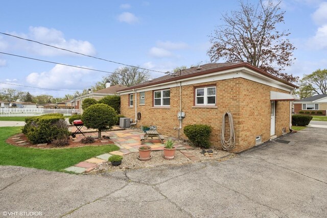 1609 Boeger Ave, Westchester, IL 60154 - view of side of home featuring brick siding and a patio