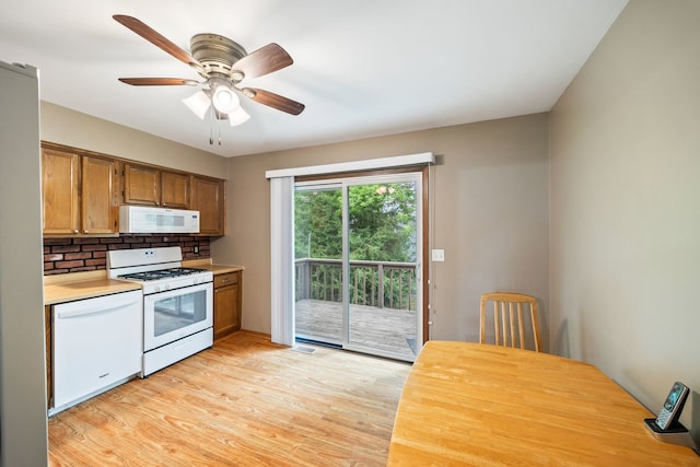 3112 Cedar Ter, Island Lake, IL 60042 - kitchen featuring white appliances, light countertops, ceiling fan, light wood-style floors, and brown cabinetry