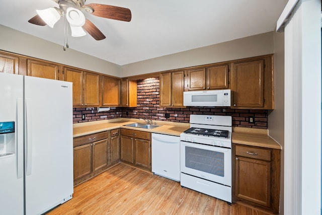 3112 Cedar Ter, Island Lake, IL 60042 - kitchen featuring white appliances, brown cabinetry, light countertops, and decorative backsplash