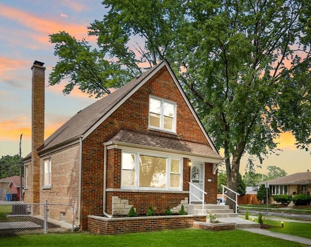 3800 W 82nd St, Chicago, IL 60652 - bungalow-style house with a chimney, brick siding, and roof with shingles