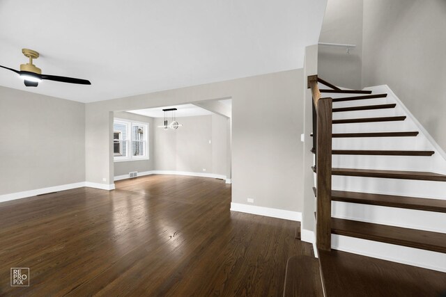 3800 W 82nd St, Chicago, IL 60652 - unfurnished living room with wood finished floors, a chandelier, stairway, and a ceiling fan