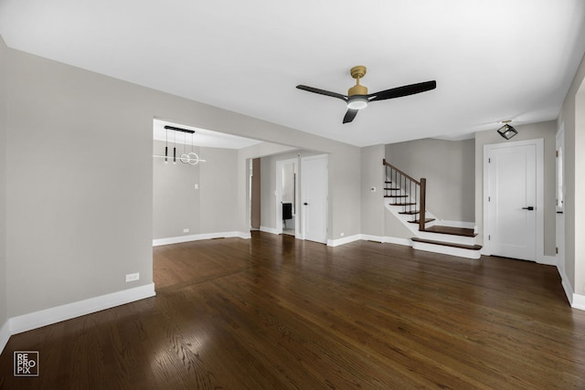 3800 W 82nd St, Chicago, IL 60652 - unfurnished living room featuring stairs, ceiling fan, dark wood finished floors, and a chandelier