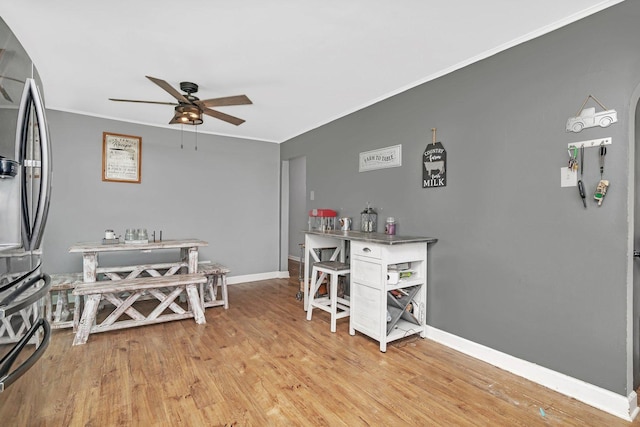 31330 S Seltzer Rd, Wilmington, IL 60481 - dining room with ornamental molding, a ceiling fan, and light wood-style floors