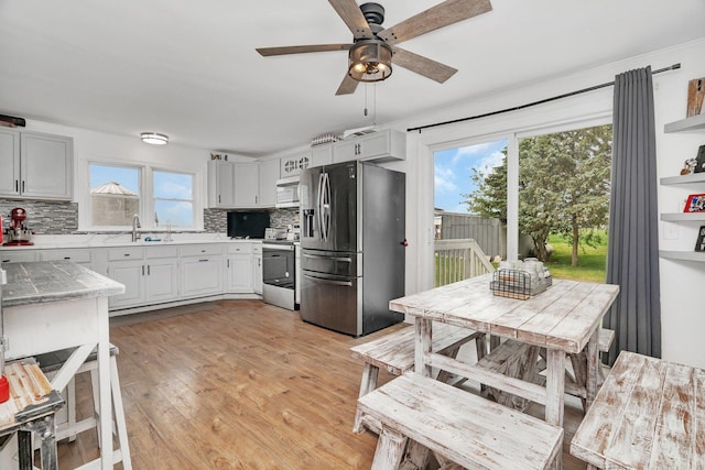 31330 S Seltzer Rd, Wilmington, IL 60481 - kitchen featuring stainless steel appliances, tasteful backsplash, plenty of natural light, and ceiling fan